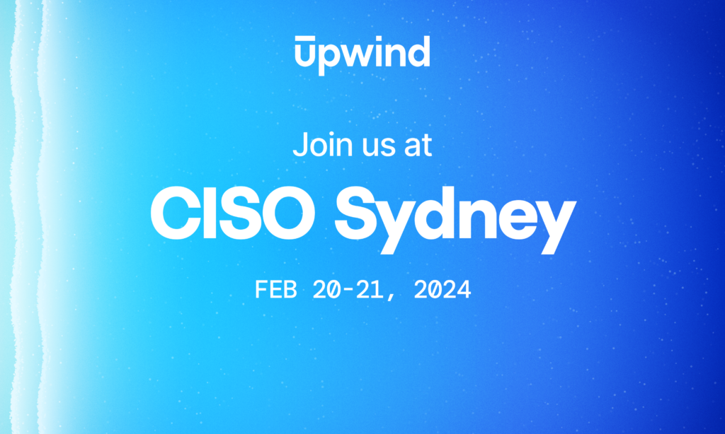Blue background with white text: Upwind. Join us at CISO Sydney. Feb 20-21, 2024. A wave-like pattern is visible on the left side.