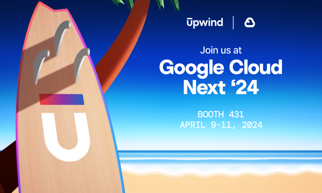 Surfboard with the letter U stands upright on a sandy beach under a palm tree. The ocean and blue sky are in the background. Text reads: Join us at Google Cloud Next 24, Booth 431, April 9-11, 2024. Upwind logo is at the top.