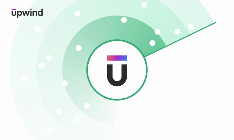 A logo with a stylized U featuring a gradient of colors above it. The logo is set against a background of green concentric circles and white dots. The word upwind is in the upper left corner.