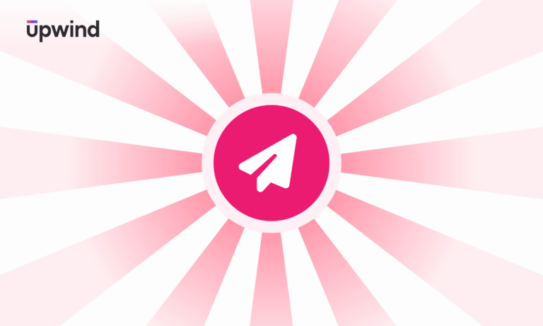 A pink and white sunburst pattern with a central white paper airplane icon in a pink circle. The top left corner has the text upwind in black.