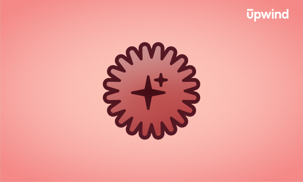 A dark red, scalloped-edged badge with two star-shaped sparkles in the center is displayed on a pink gradient background. The word Upwind appears in white text in the top right corner, hinting at the intriguing question: What is Dark AI?.