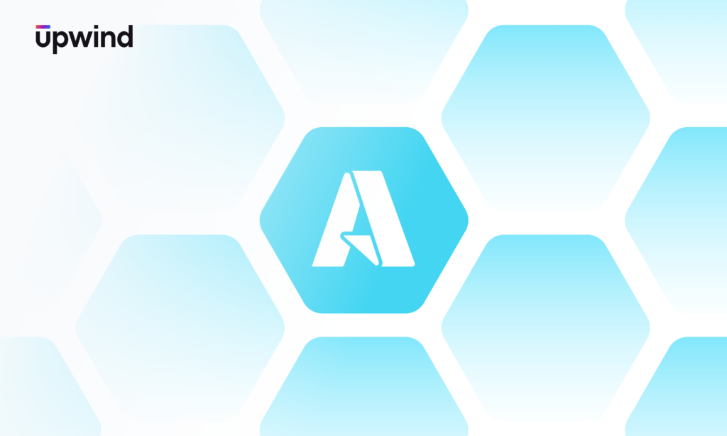 The Upwind logo in black and purple is in the top left, with a large stylized A in a white hexagon surrounded by blue hexagons on a light blue background.